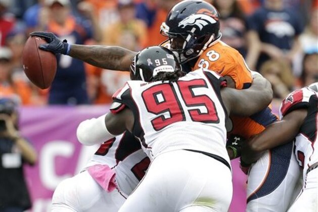 Denver Broncos wide receiver Demaryius Thomas (88) reaches across the goal line for a touchdown as Atlanta Falcons nose tackle Jonathan Babineaux (95) defends during the second half of an NFL football game, Sunday, Oct. 9, 2016, in Denver. (AP Photo/Joe Mahoney)