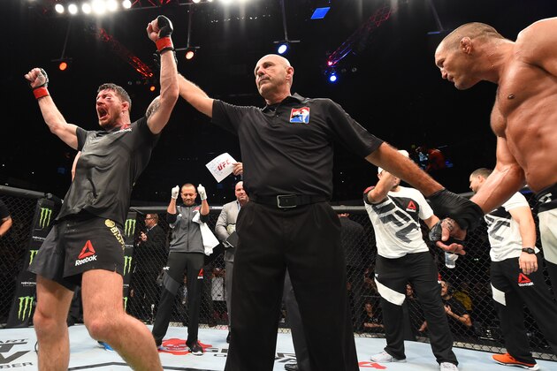 MANCHESTER, ENGLAND - OCTOBER 08: (L-R) Michael Bisping of England celebrates his victory over Dan Henderson in their UFC middleweight championship bout during the UFC 204 Fight Night at the Manchester Evening News Arena on October 8, 2016 in Manchester, England. (Photo by Josh Hedges/Zuffa LLC/Zuffa LLC via Getty Images) MANCHESTER, ENGLAND - OCTOBER 08: (L-R) Michael Bisping of England celebrates his victory over Dan Henderson in their UFC middleweight championship bout during the UFC 204 Fight Night at the Manchester Evening News Arena on October 8, 2016 in Manchester, England. (Photo by Josh Hedges/Zuffa LLC/Zuffa LLC via Getty Images)