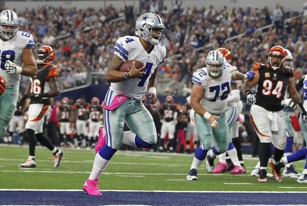 Oct 9, 2016; Arlington, TX, USA; Dallas Cowboys quarterback Dak Prescott (4) runs into the end zone for a touchdown in the second quarter against the Cincinnati Bengals at AT&T Stadium. Mandatory Credit: Tim Heitman-USA TODAY Sports