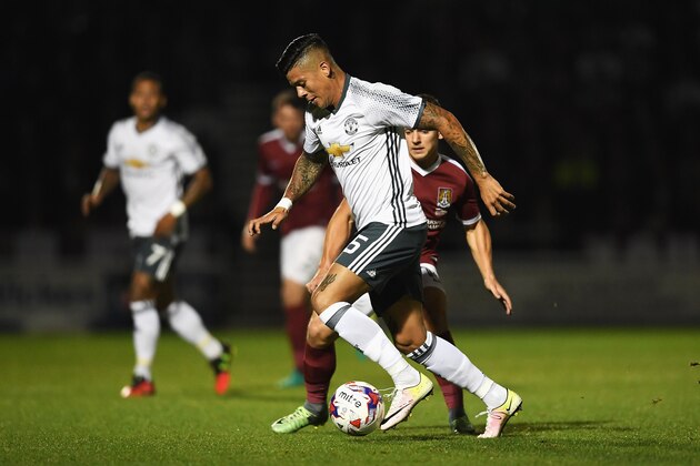 NORTHAMPTON, ENGLAND - SEPTEMBER 21:  Marcos Rojo of Manchester United and Sam Hoskins of Northampton Town during the  EFL Cup Third Round match between Northampton Town and Manchester United at Sixfields on September 21, 2016 in Northampton, England.  (Photo by Laurence Griffiths/Getty Images)