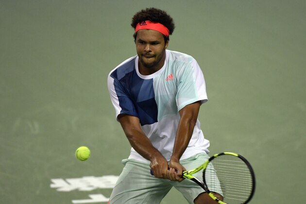 SHANGHAI, CHINA - OCTOBER 10:  Jo-Wilfried Tsonga of France returns a shot to Florian Mayer of Germany during the first round of ATP Shanghai Rolex Masters 2016 on Day 2 at Qi Zhong Tennis Centre on October 10, 2016 in Shanghai, China.  (Photo by Kevin Lee/Getty Images)