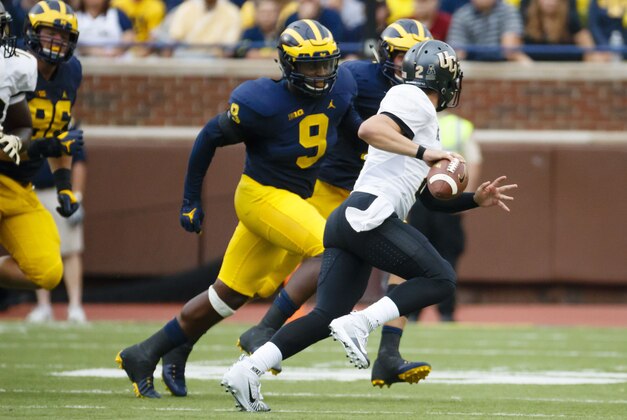Sep 10, 2016; Ann Arbor, MI, USA; UCF Knights quarterback Nick Patti (2) pressured by Michigan Wolverines linebacker Mike McCray (9) in the second quarter at Michigan Stadium. Mandatory Credit: Rick Osentoski-USA TODAY Sports