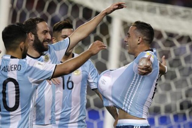 Argentina's Ramiro Funes Mori, right, celebrates with his teammates after scoring against Peru during a 2018 World Cup qualifying soccer match in Lima, Peru, Thursday, Oct. 6, 2016. (AP Photo/Martin Mejia)