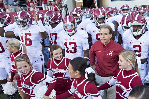 FAYETTEVILLE, AR - OCTOBER 8:  Head Coach Nick Saban and the Alabama Crimson Tide players wait to run onto the field before a game against the Arkansas Razorbacks at Razorback Stadium on October 8, 2016 in Fayetteville, Arkansas.  The Crimson Tide defeated the Razorbacks 49-30.  (Photo by Wesley Hitt/Getty Images)