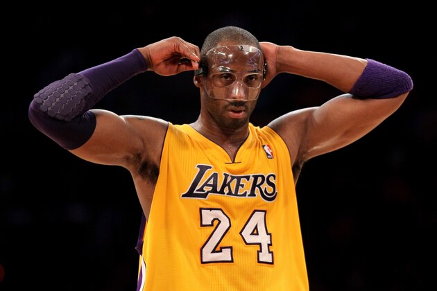 LOS ANGELES, CA - MARCH 02:  Kobe Bryant #24 of the Los Angeles Lakers adjusts his protective face mask during the game with the Sacramento Kings at Staples Center on March 2, 2012 in Los Angeles, California.   The Lakers won 115-107. NOTE TO USER: User expressly acknowledges and agrees that, by downloading and or using this photograph, User is consenting to the terms and conditions of the Getty Images License Agreement.  (Photo by Stephen Dunn/Getty Images)