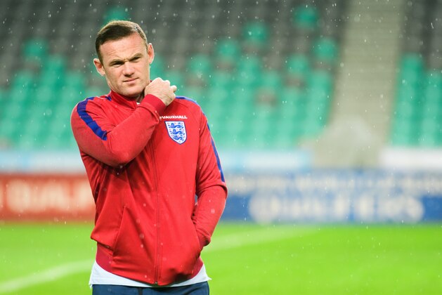 England's striker Wayne Rooney (L) walks on the pitch on the eve of the World Cup 2018 football qualification match between Slovenia and England in Ljubljana,  on October 10, 2016. / AFP / Jure MAKOVEC        (Photo credit should read JURE MAKOVEC/AFP/Getty Images)