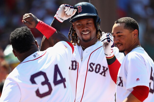 BOSTON, MA - JULY 04:  Hanley Ramirez #13 of the Boston Red Sox celebrates with David Ortiz #34 and Mookie Betts #50 after scoring a run against the Texas Rangers  during the third inning at Fenway Park on July 4, 2016 in Boston, Massachusetts.  (Photo by Maddie Meyer/Getty Images)
