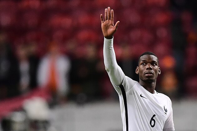 France's midfielder Paul Pogba celebrates his team's victory at the end of the FIFA World Cup 2018 qualifying football match Netherlands vs France on October 10, 2016 at the Amsterdam Arena in Amsterdam.  / AFP / EMMANUEL DUNAND        (Photo credit should read EMMANUEL DUNAND/AFP/Getty Images)