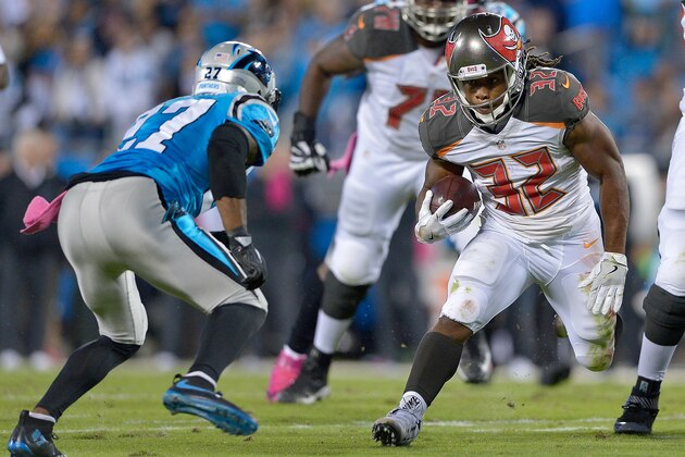 CHARLOTTE, NC - OCTOBER 10:  Jacquizz Rodgers #32 of the Tampa Bay Buccaneers runs the ball against Robert McClain #27 of the Carolina Panthers in the 1st quarter during the game at Bank of America Stadium on October 10, 2016 in Charlotte, North Carolina.  (Photo by Grant Halverson/Getty Images)