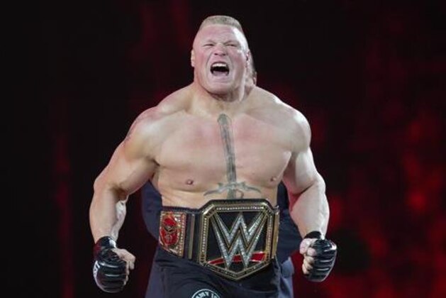 FILE - In this March 29, 2015, file photo, Brock Lesnar makes his entrance at Wrestlemania XXXI in Santa Clara, Calif. Lesnar, the former WWE and UFC heavyweight champion, was selected Monday, June 27, 2016, as the cover superstar for the WWE 2K17 video game that is set for an Oct. 11 release.  (AP Photo/Don Feria, File)