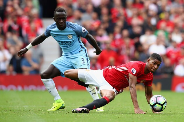 MANCHESTER, ENGLAND - SEPTEMBER 10:  Marcus Rashford of Manchester United in action with Bacary Sagna of  Manchester City during the Premier League match between Manchester United and Manchester City at Old Trafford on September 10, 2016 in Manchester, England.  (Photo by Clive Brunskill/Getty Images)