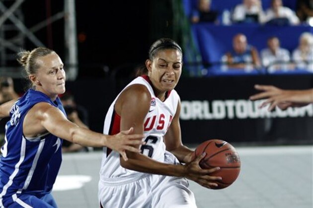 United States' Bria Hartley controls the ball as Sylvie Gruszczynski of France tries to block during the final game of the  3X3 World Basketball Championship  in front of Zappeion Hall in Athens, Sunday, Aug. 26, 2012. The US women's team won the game 17 - 16.   (AP Photo/Kostas Tsironis)