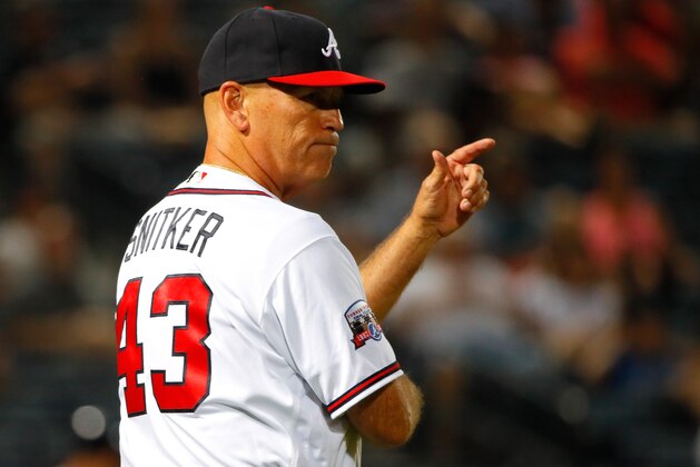 ATLANTA, GA - MAY 25:  Brian Snitker #43 of the Atlanta Braves calls for a pitching substitution in the eighth inning against the Milwaukee Brewers at Turner Field on May 25, 2016 in Atlanta, Georgia.  (Photo by Kevin C. Cox/Getty Images)