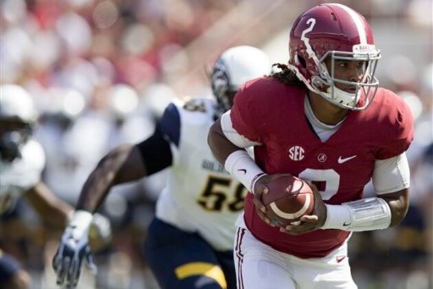 Alabama quarterback Jalen Hurts runs the ball in the first half during an NCAA college football game against Kent State, Saturday, Sept. 24, 2016, in Tuscaloosa, Ala. (AP Photo/Brynn Anderson)