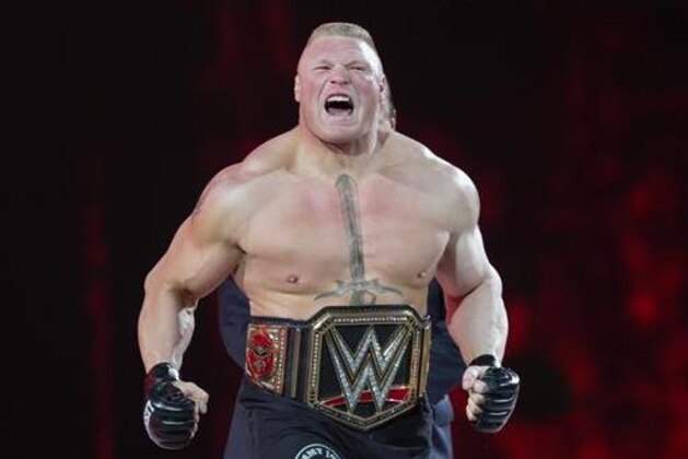 FILE - In this March 29, 2015, file photo, Brock Lesnar makes his entrance at Wrestlemania XXXI in Santa Clara, Calif. Lesnar, the former WWE and UFC heavyweight champion, was selected Monday, June 27, 2016, as the cover superstar for the WWE 2K17 video game that is set for an Oct. 11 release.  (AP Photo/Don Feria, File)