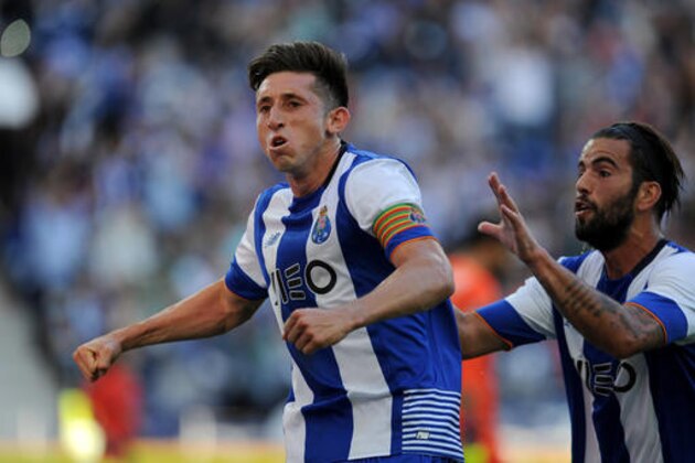 Porto's Porto's Hector Herrera celebrates with Porto's Sergio Oliveira, right, after scoring his side's first goal against Sporting in a Portuguese League soccer match at the Dragao stadium in Porto, Portugal, Saturday, April 30, 2016.(AP Photo/Paulo Duarte)