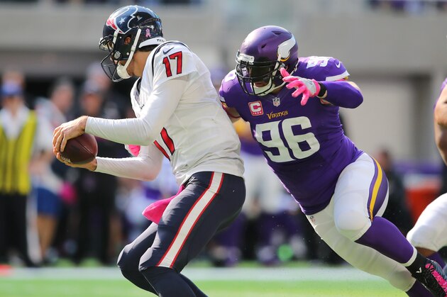 MINNEAPOLIS, MN - OCTOBER 9:  Brian Robison #96 of the Minnesota Vikings attempts to tackle Brock Osweiler #17 of the Houston Texans during the fourth quarter of the game on October 9, 2016 at US Bank Stadium in Minneapolis, Minnesota. (Photo by Adam Bettcher/Getty Images)