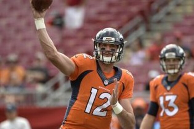Denver Broncos quarterback Paxton Lynch (12) and quarterback Trevor Siemian (13) warm up before an NFL football game against the Tampa Bay Buccaneers in Tampa, Fla., Sunday, Oct. 2, 2016. (AP Photo/Phelan M. Ebenhack)