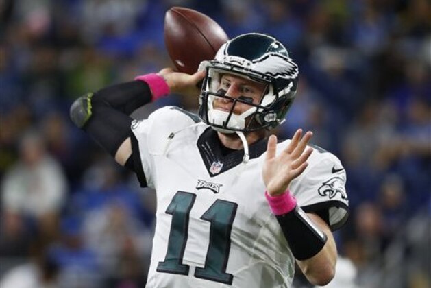 Philadelphia Eagles quarterback Carson Wentz throws on the sidelines against the Detroit Lions during an NFL football game in Detroit, Sunday, Oct. 9, 2016. Detroit beat Philadelphia 24-23. (AP Photo/Paul Sancya)