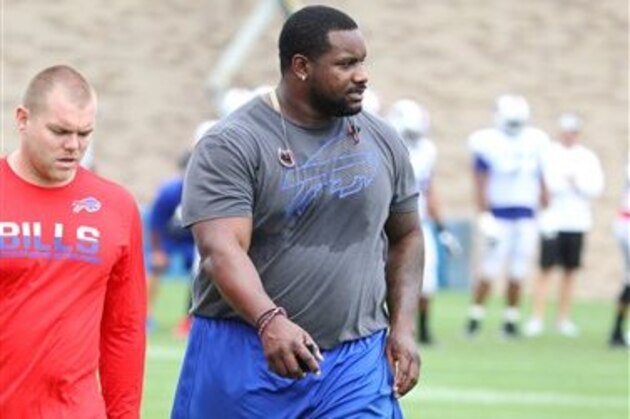 Buffalo Bills defensive tackle Marcell Dareus, right, takes part in drills during NFL football training camp in Pittsford, N.Y., Monday, Aug. 1, 2016. (AP Photo/Bill Wippert)