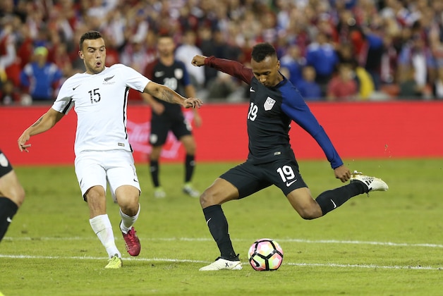 Oct 11, 2016; Washington, D.C., USA; United States forward Julian Green (19) shoots the ball as New Zealand midfielder Clayton Lewis (15) defends in the second half at RFK Stadium. The game ended in a 1-1 tie. Mandatory Credit: Geoff Burke-USA TODAY Sports
