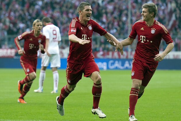 Bayern Munich's midfielder Bastian Schweinsteiger (C) celebrates with his teammate Bayern Munich's midfielder Toni Kroos (R) after scoring the 2-0 during the German first division Bundesliga football match FC Bayern Munich vs 1. FC Nuremberg in the southern German city of Munich on October 29, 2011.   AFP PHOTO / GUENTER SCHIFFMANN

RESTRICTIONS / EMBARGO - DFL LIMITS THE USE OF IMAGES ON THE INTERNET TO 15 PICTURES (NO VIDEO-LIKE SEQUENCES) DURING THE MATCH AND PROHIBITS MOBILE (MMS) USE DURING AND FOR FURTHER TWO HOURS AFTER THE MATCH. FOR MORE INFORMATION CONTACT DFL. (Photo credit should read GUENTER SCHIFFMANN/AFP/Getty Images)
