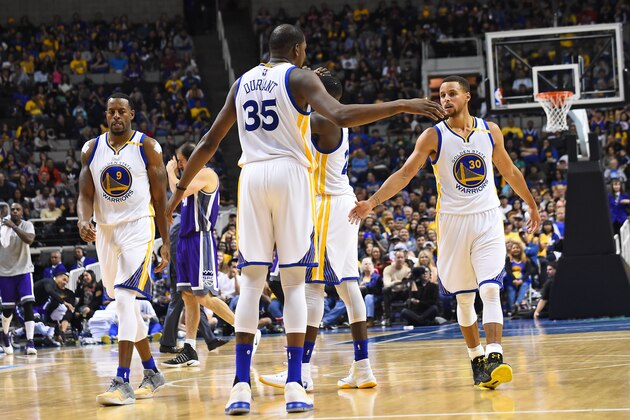 SAN JOSE, CA - OCTOBER 6: Kevin Durant #35 of the Golden State Warriors shakes hands with Stephen Curry #30 during a preseason game against the Sacramento Kings on October 6, 2016 at SAP Center in San Jose, California. NOTE TO USER: User expressly acknowledges and agrees that, by downloading and or using this photograph, user is consenting to the terms and conditions of Getty Images License Agreement. Mandatory Copyright Notice: Copyright 2016 NBAE (Photo by Noah Graham/NBAE via Getty Images)
