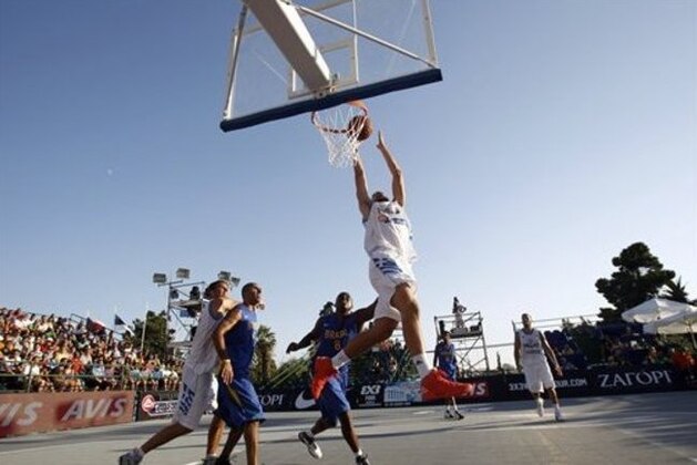 Greece's Charalampos Giannopoulos shoots during a basketball game against Brazil  for the  3X3 World basketball Championship    in front of Zappeion hall in Athens, Saturday Aug. 25, 2012.  (AP Photo/Kostas Tsironis)