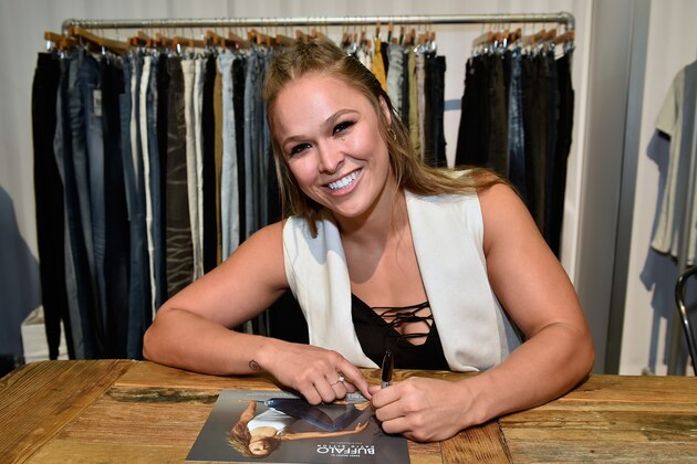 LAS VEGAS, NV - AUGUST 15:  Buffalo David Bitton Brand Ambassador Ronda Rousey signs an autograph at the Buffalo David Bitton booth during Project Vegas at the Mandalay Bay Convention Center on August 15, 2016 in Las Vegas, Nevada.  (Photo by David Becker/Getty Images for Buffalo David Bitton)