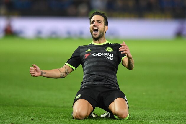 Chelsea's Spanish midfielder Cesc Fabregas celebrates scoring their fourth goal during extra-time in the English League Cup third round football match between Leicester City and Chelsea at King Power Stadium in Leicester, central England on September 20, 2016. / AFP / Anthony DEVLIN / RESTRICTED TO EDITORIAL USE. No use with unauthorized audio, video, data, fixture lists, club/league logos or 'live' services. Online in-match use limited to 75 images, no video emulation. No use in betting, games or single club/league/player publications.  /         (Photo credit should read ANTHONY DEVLIN/AFP/Getty Images)