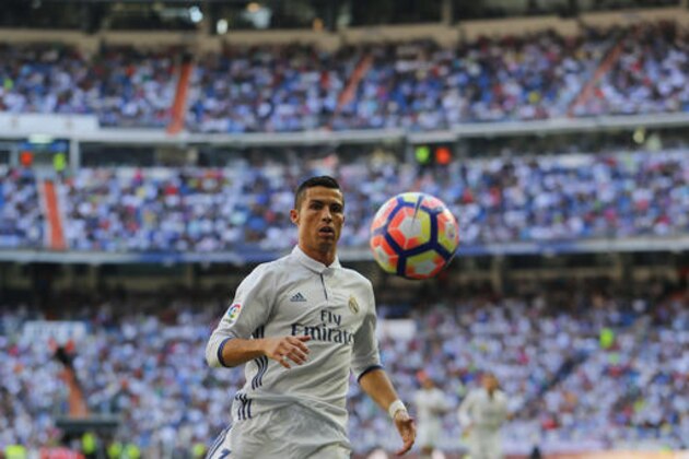Real Madrid's Cristiano Ronaldo looks at the ball during the Spanish La Liga soccer match between Real Madrid and Eibar at the Santiago Bernabeu stadium in Madrid, Sunday, Oct. 2, 2016. The match ended in a 1-1 draw. (AP Photo/Francisco Seco)