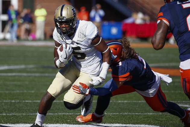 CHAMPAIGN, IL - OCTOBER 08: Domonique Young #5 of the Purdue Boilermakers runs the ball as Taylor Barton #3 of the Illinois Fighting Illini tries to make the tackle at Memorial Stadium on October 8, 2016 in Champaign, Illinois. (Photo by Michael Hickey/Getty Images)