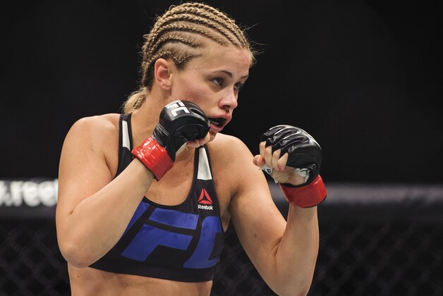 Aug 27, 2016; Vancouver, BC, Canada; Bec Rawlings (blue gloves) fights Paige VanZant (red gloves) during UFC Fight Night at Rogers Arena. Mandatory Credit: Anne-Marie Sorvin-USA TODAY Sports