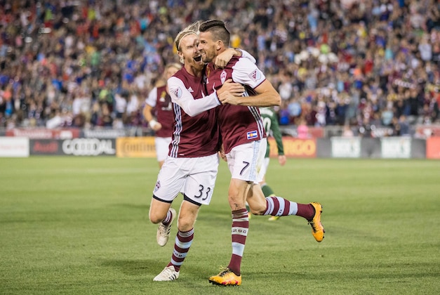 Oct 1, 2016; Commerce City, CO, USA; Colorado Rapids midfielder Jared Watts (33) celebrates the goal of forward Sebastien Le Toux (7) in the second half against the Portland Timbers at Dick's Sporting Goods Park. Mandatory Credit: Isaiah J. Downing-USA TODAY Sports