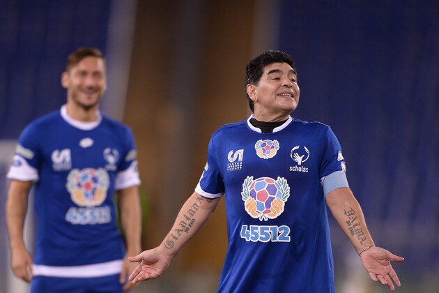 Argentinian football legend Diego Armando Maradona gestures during the 'Match of Peace - United for Peace' charity football match promoted by the Schools for Encounter foundation at the Olympic stadium in Rome on October 12, 2016.  / AFP / FILIPPO MONTEFORTE        (Photo credit should read FILIPPO MONTEFORTE/AFP/Getty Images)