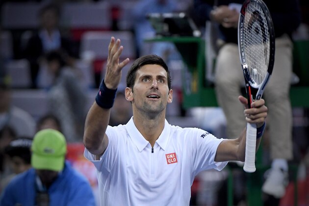 Novak Djokovic of Serbia celebrates after winning against Vasek Pospisil of Canada during the men's singles match at the Shanghai Masters tennis tournament in Shanghai on October 13, 2016. / AFP / WANG ZHAO        (Photo credit should read WANG ZHAO/AFP/Getty Images)