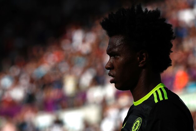 Chelsea's Brazilian midfielder Willian looks on during the English Premier League football match between Swansea City and Chelsea at The Liberty Stadium in Swansea, south Wales on September 11, 2016. / AFP / Adrian DENNIS / RESTRICTED TO EDITORIAL USE. No use with unauthorized audio, video, data, fixture lists, club/league logos or 'live' services. Online in-match use limited to 75 images, no video emulation. No use in betting, games or single club/league/player publications.  /         (Photo credit should read ADRIAN DENNIS/AFP/Getty Images)