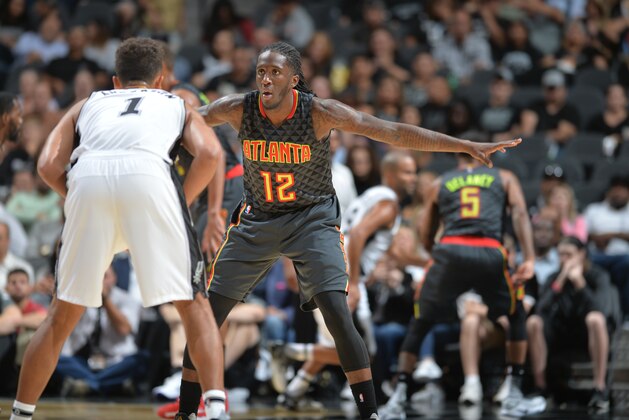 SAN ANTONIO, TX - OCTOBER 8: Taurean Prince #12 of the Atlanta Hawks plays defense against the San Antonio Spurs on October 8, 2016 at the AT&T Center in San Antonio, Texas. NOTE TO USER: User expressly acknowledges and agrees that, by downloading and or using this photograph, user is consenting to the terms and conditions of the Getty Images License Agreement. Mandatory Copyright Notice: Copyright 2016 NBAE (Photos by Mark Sobhani/NBAE via Getty Images)