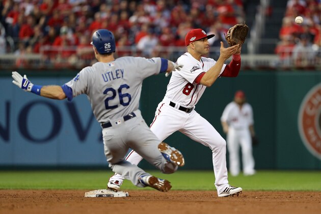 WASHINGTON, DC - OCTOBER 7: Chase Utley #26 of the Los Angeles Dodgers is forced out at second base by Danny Espinosa #8 of the Washington Nationals for the first out of the third inning in game one of the National League Division Series at Nationals Park on October 7, 2016 in Washington, DC. (Photo by Patrick Smith/Getty Images)