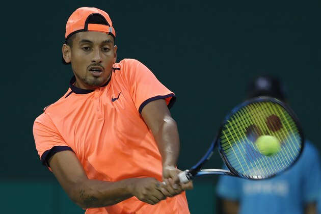 SHANGHAI, CHINA - OCTOBER 12:  Nick Kyrgios of Australia returns a shot against Mischa Zverev of Germany during the Men's singles second round match on day four of Shanghai Rolex Masters at Qi Zhong Tennis Centre on October 12, 2016 in Shanghai, China.  (Photo by Lintao Zhang/Getty Images)