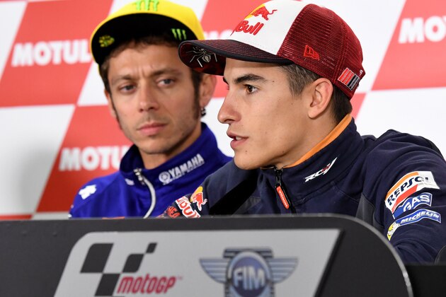 Repsol Honda Team's Spanish rider Marc Marquez (R) answers a question beside Movistar Yamaha MotoGP's Italian rider Valentino Rossi (L) during a press conference at the Japanese Grand Prix in the Twin Ring Motegi circuit in Motegi on October 13, 2016. / AFP / TOSHIFUMI KITAMURA        (Photo credit should read TOSHIFUMI KITAMURA/AFP/Getty Images)