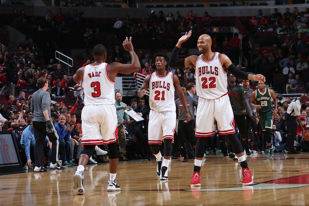 CHICAGO, IL - OCTOBER 3:  Dwyane Wade #3, Jimmy Butler #21 and Taj Gibson #22 of the Chicago Bulls give high fives drives to the basket against the Milwaukee Bucks during a preseason game on October 3, 2016 at United Center in Chicago, IL. NOTE TO USER: User expressly acknowledges and agrees that, by downloading and/or using this Photograph, user is consenting to the terms and conditions of the Getty Images License Agreement. Mandatory Copyright Notice: Copyright 2016 NBAE (Photo by Gary Dineen/NBAE via Getty Images)