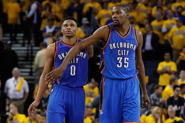 OAKLAND, CA - MAY 16:  Kevin Durant #35 (R) of the Oklahoma City Thunder celebrates with Russell Westbrook #0 during the final moments of game one of the NBA Western Conference Finals against the Golden State Warriors at ORACLE Arena on May 16, 2016 in Oakland, California. The Thunder defeated the Warriors 108-102. NOTE TO USER: User expressly acknowledges and agrees that, by downloading and or using this photograph, User is consenting to the terms and conditions of the Getty Images License Agreement.  (Photo by Christian Petersen/Getty Images)