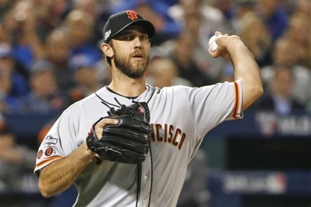 San Francisco Giants starting pitcher Madison Bumgarner (40) throws to first during the first inning of a National League wild-card baseball game against the New York Mets, Wednesday, Oct. 5, 2016, in New York.  (AP Photo/Kathy Willens)