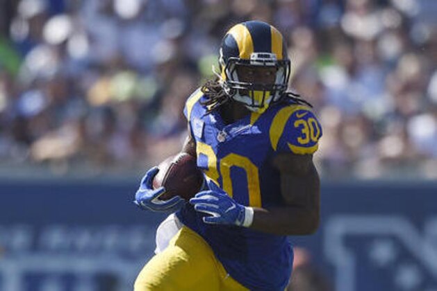 FILE - In this Sept. 18, 2016, file photo, Los Angeles Rams running back Todd Gurley (30) runs against the Seattle Seahawks during an NFL game in Los Angeles. The Rams and Lions play Sunday, Oct. 16, 2016.  (AP Photo/Kelvin Kuo, File)