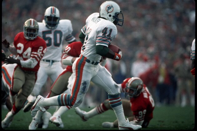 STANFORD, CA - JANUARY 20:  Punt returner/kick returner Fulton Walker #41 of the Miami Dolphins runs with the football during Super Bowl XIX against the San Francisco 49ers at Stanford Stadium on January 20, 1985 in Stanford, California.  The 49ers defeated the Dolphins 38-16.  (Photo by George Gojkovich/Getty Images)
