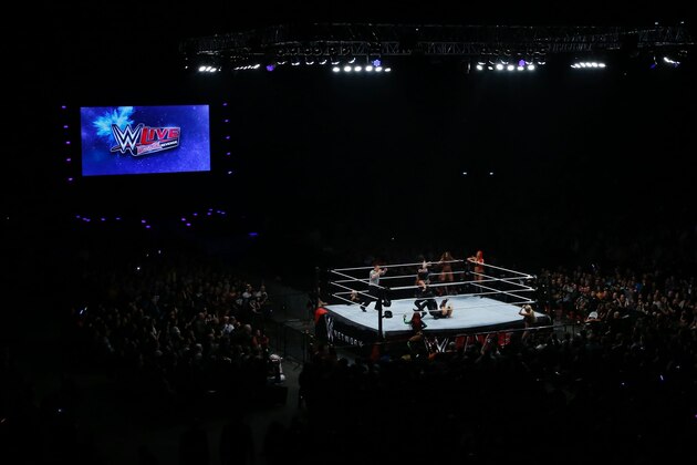 Wrestlers fight during a show at the AccorHotels Arena in Paris, as part of the WrestleMania Revenge Tour, the World Wrestling Entertainment (WWE) European tour, on April 22, 2016. / AFP / THOMAS SAMSON        (Photo credit should read THOMAS SAMSON/AFP/Getty Images)