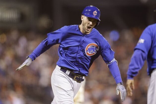 Chicago Cubs' Kris Bryant, left, celebrates after hitting a two-run home run against the San Francisco Giants during the ninth inning of Game 3 of baseball's National League Division Series in San Francisco, Monday, Oct. 10, 2016. (AP Photo/Ben Margot)