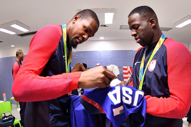 RIO DE JANEIRO, BRAZIL - AUGUST 21:  Kevin Durant #5 of the USA Basketball Men's National Team and Draymond Green #14 of the USA Basketball Men's National Team celebrates after the Gold Medal Game on Day 16 of the Rio 2016 Olympic Games on August 21, 2016 at Barra Carioca Arena 1 in Rio de Janerio, Brazil. NOTE TO USER: User expressly acknowledges and agrees that, by downloading and or using this photograph, user is consenting to the terms and conditions of Getty Images License Agreement. Mandatory Copyright Notice: Copyright 2016 NBAE (Photo by Jesse D. Garrabrant/NBAE via Getty Images)