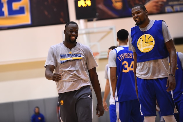 OAKLAND, CA - OCTOBER 08:  Draymond Green #23 and Kevin Durant #35 of the Golden State Warriors during practice on October 8, 2016 at the Warriors Practice Facility in Oakland, California.  NOTE TO USER: User expressly acknowledges and agrees that, by downloading and/or using this Photograph, user is consenting to the terms and conditions of the Getty Images License Agreement. Mandatory Copyright Notice: Copyright 2016 NBAE (Photo by David Dow/NBAE via Getty Images)